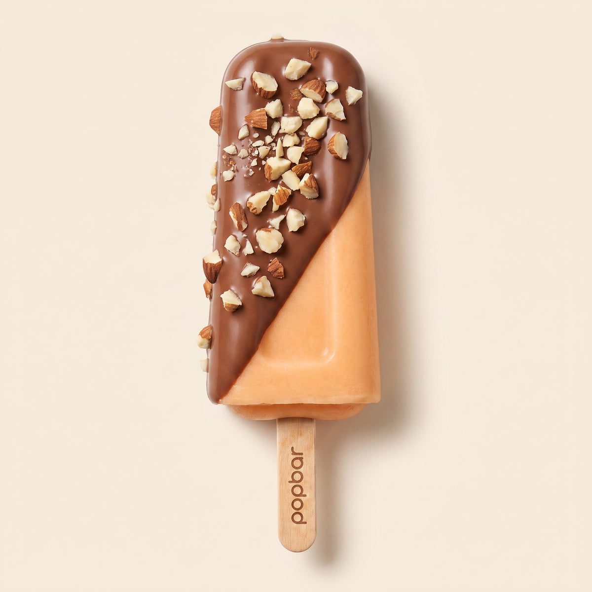 Popbar peach sorbetto with milk chocolate dip and crushed almonds