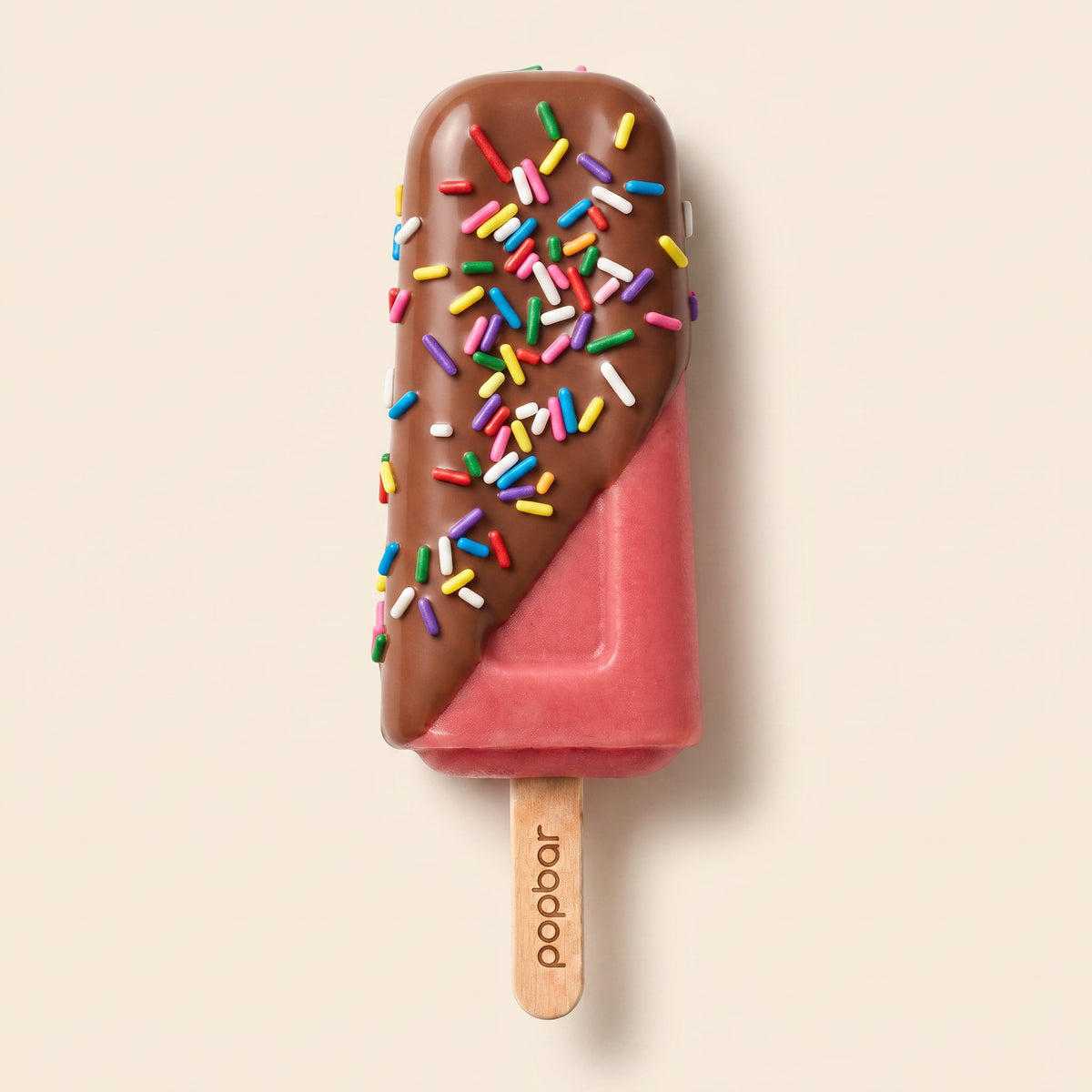 Popbar strawberry sorbetto with milk chocolate dip and rainbow sprinkles