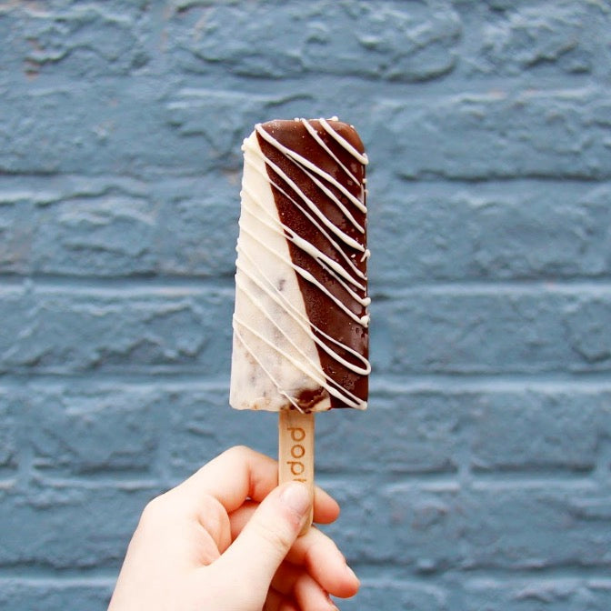 Cookies & Cream gelato ice cream popsicle dipped in dark chocolate and drizzled with white chocolate