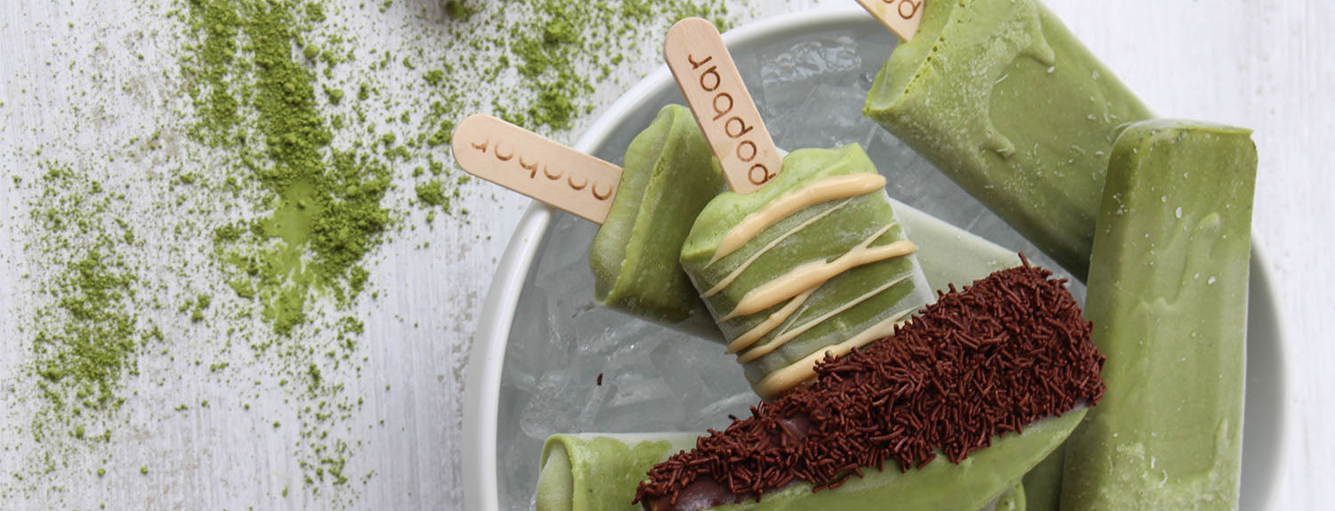 Popbar gelato pops lined up in the shop display case.